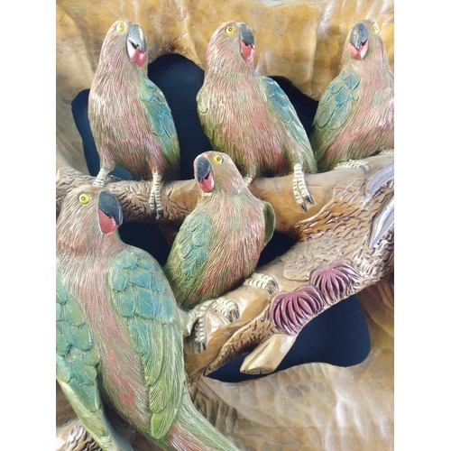 12 - A spectacular hand-carved wooden plaque depicting 5 parrots on a branch.  Measures approx 50x50cm#12... 