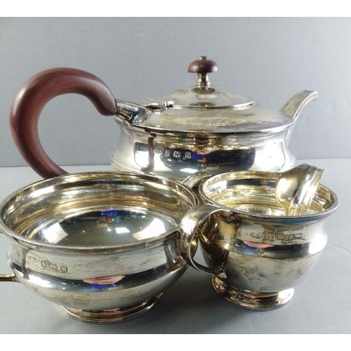 140 - Silver Tea Service comprising teapot, sugar and cream. Hallmarked Birmingham 1936 by Albert Edward J... 