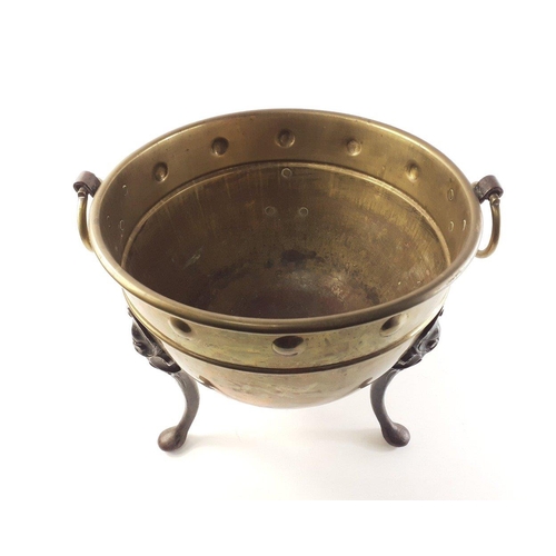 198 - A rather lovely twin-handled jardiniere in brass with cast iron feet D36 x H33cm approx.  In overall... 