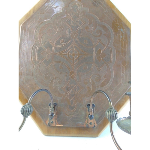 201 - A most unusual wooden wall plaque with an attractive copper design plate and 2 copper candlesticks, ... 