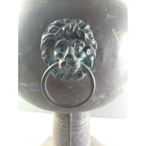 202 - A wonderful copper jardinière with lion head handle.  Stands 40cm tall approx. Wonderful patination ... 