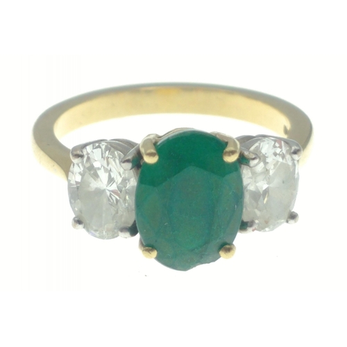 22 - A magnificent three stone Emerald and Diamond ring comprising a 2.07ct Emerald and 1.43ct of oval cu... 