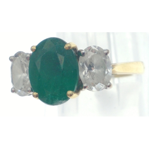 22 - A magnificent three stone Emerald and Diamond ring comprising a 2.07ct Emerald and 1.43ct of oval cu... 