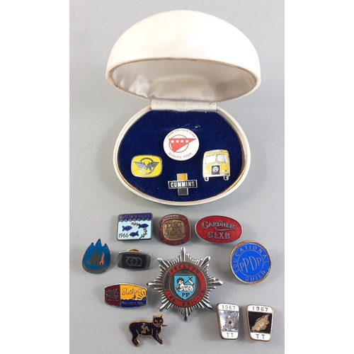 220 - A clamshell case filled with various pins and badges including TT 1967, Butlin's Filey 1966#228