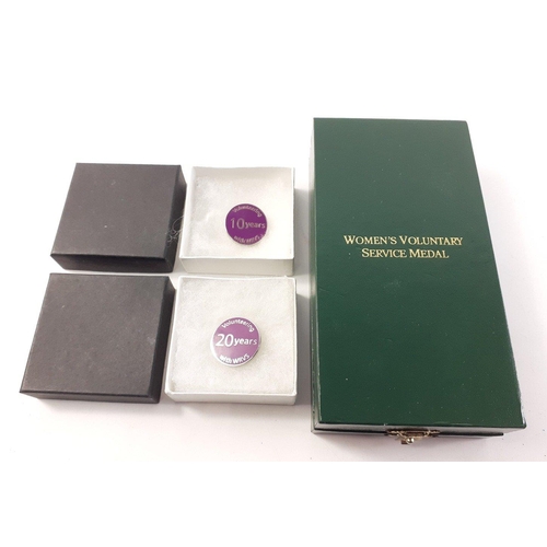 223 - A WRVS BEYOND SELF SERVICE medal with ribbon, in original presentation box with the original instruc... 