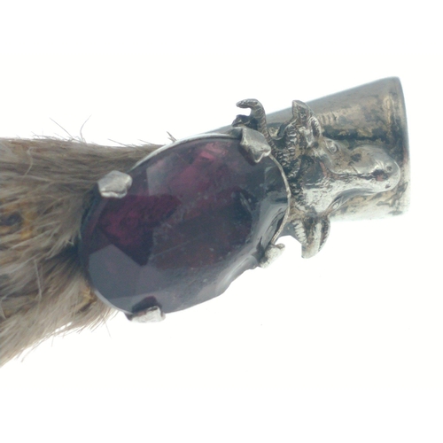 238 - A Sterling Silver mounted Ptarmigan claw with purple stone by W.B.S.  8cm approx. 11.9g approx.  One... 