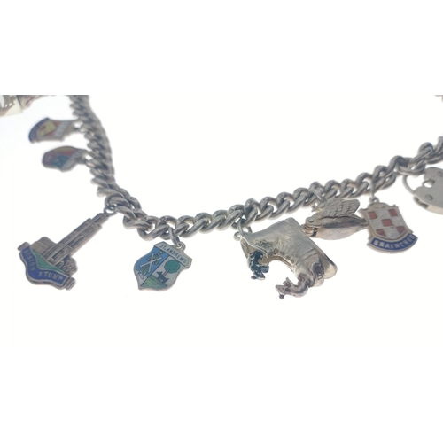 245 - A silver stamped (each link lion mark) charm bracelet with places of the world etc - weight 91g appr... 