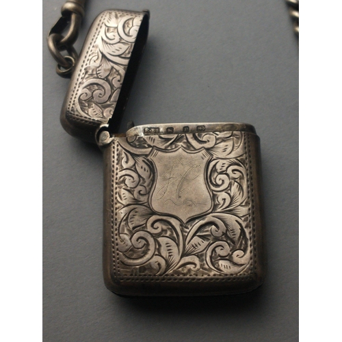 264 - A sterling silver Albert chain with a hallmarked vesta case and a fob.  Gross weight 63g approx#272... 