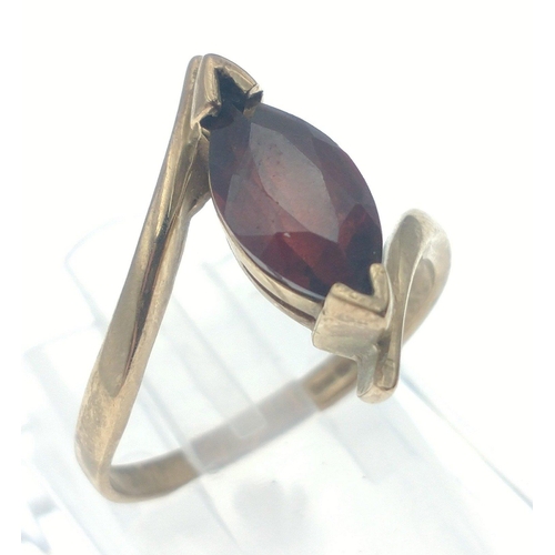 28 - A lovely 9ct gold ring with a lovely Marquise cut garnet.  Size N. Weight 3.15g approx. Stone measur... 