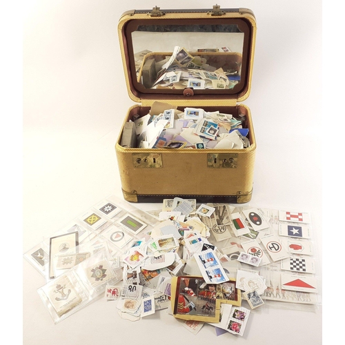 294 - A vanity case filled with contents of stamps, and some cigarette cards,#304