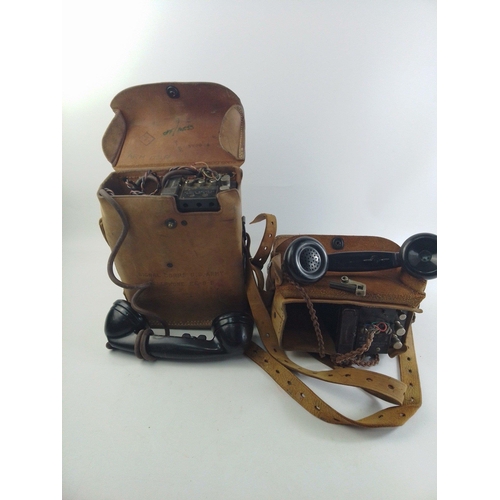 302 - Two US ARMY SIGNAL CORPS telephone EE-8-B in leather pouches with hand-sets.  Some writing to cases ... 