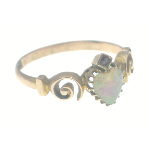 41 - A 9ct gold ring with a beautiful sweetheart cut opal with garnet set above, and lovely twisted shoul... 