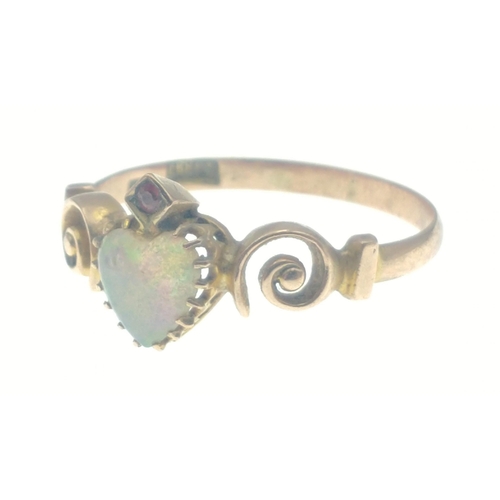 41 - A 9ct gold ring with a beautiful sweetheart cut opal with garnet set above, and lovely twisted shoul... 