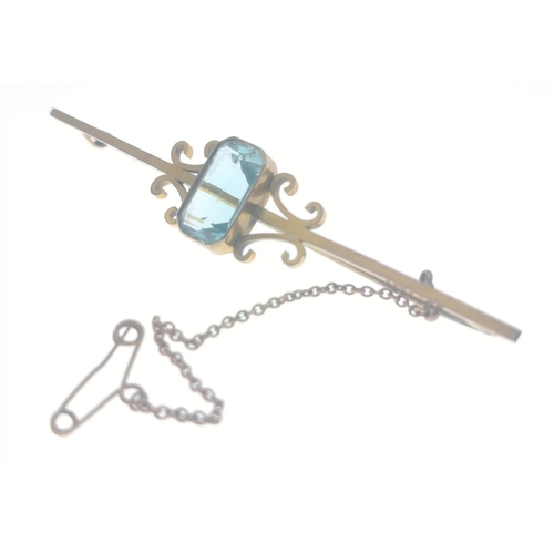 47 - A beautiful bar brooch set with an aquamarine (15mm approx) and with safety chain.  Bar stamped 9ct ... 