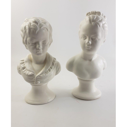 670 - Two attractive busts, one of a young boy and one of a young girl.  Standing each approximately 23cm ... 