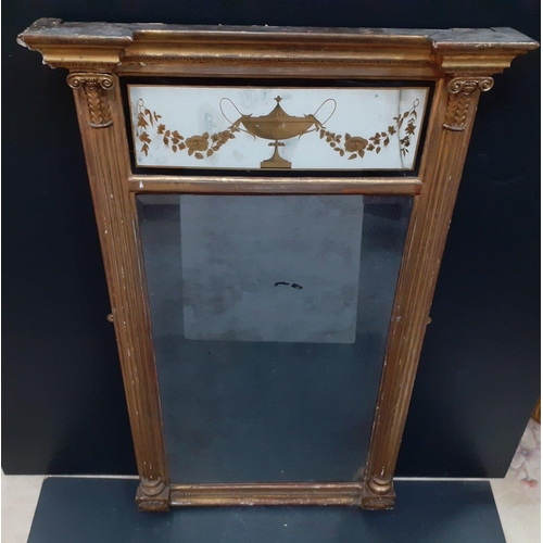 671 - An antique ornate gilt overmantle mirror with wreathed swagger glass panel to top.  Some damage to t... 