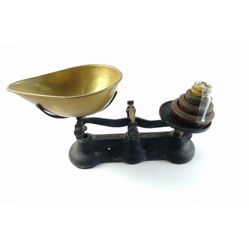 712 - A set of balance scales by JOHN WHITE & SON of AUCHTERMUCHTY with pan and weights.  Weighs up to... 