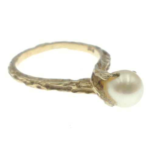 80 - An indistinctly marked yellow metal ring with a large centre natural pearl, size M, gross weight 3.3... 