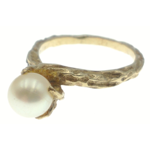 80 - An indistinctly marked yellow metal ring with a large centre natural pearl, size M, gross weight 3.3... 