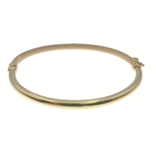 98 - A beautiful fully hallmarked 375 gold bangle with clasp,  small dent to the band. Weight 4.95g appro... 