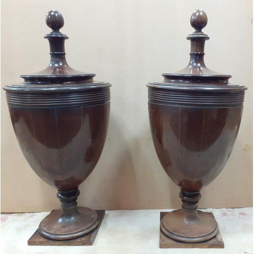 178 - A pair of early 19th century SHERATON style urn-shaped mahogany knife/spoon box, the lid with acorn ... 