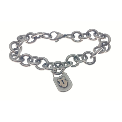 234 - Silver 925 marked TIFFANY & CO chain link bracelet weight 29.96g approx with yellow metal lock.#... 