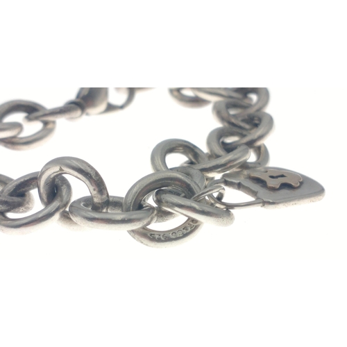 234 - Silver 925 marked TIFFANY & CO chain link bracelet weight 29.96g approx with yellow metal lock.#... 