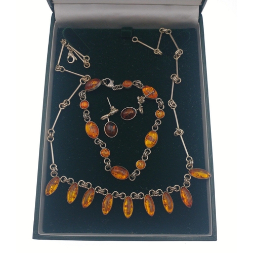 242 - AMBER on sterling silver suite of jewellery comprising necklace, bracelet and earrings. A gorgeous s... 