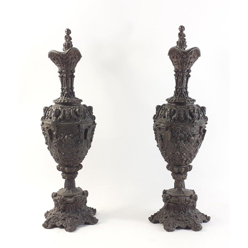 355 - A pair of 19th century GOTHIC bronzed HARVEST EWERS with flora and cherub decoration - dimensions 44... 