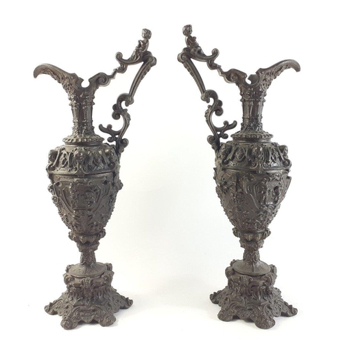 355 - A pair of 19th century GOTHIC bronzed HARVEST EWERS with flora and cherub decoration - dimensions 44... 