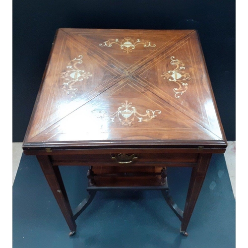 474 - An inlaid marquetry card table with four fold out quarter leaves with recessed token holders. On ori... 