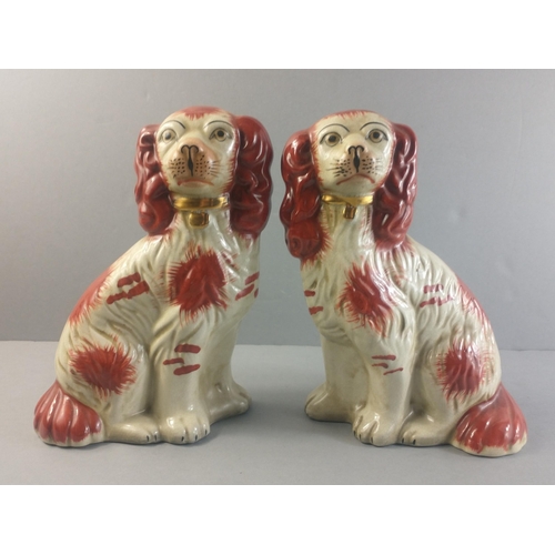 522 - A pair of quality rust coloured Staffordshire Wally dogs standing approx 25cm high.  No damage#130... 