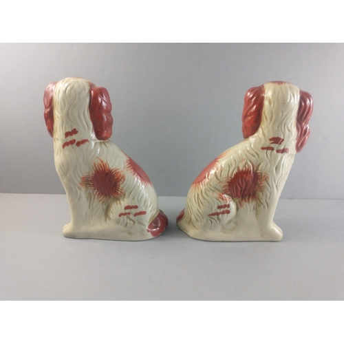 522 - A pair of quality rust coloured Staffordshire Wally dogs standing approx 25cm high.  No damage#130... 