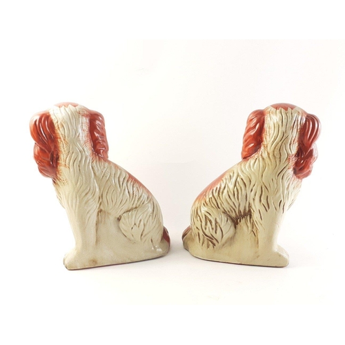 526 - A pair of nice quality Staffordshire Wally dogs in the more unusual red colour, standing 31cm tall a... 