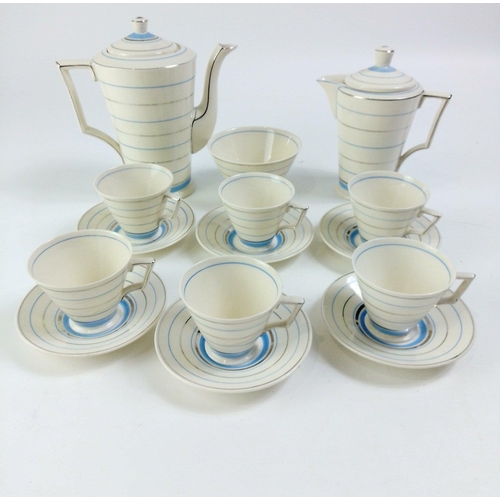 588 - A vintage CORONA WARE coffee service with a circular blue and silver pattern, comprising 6 cups, 6 s... 