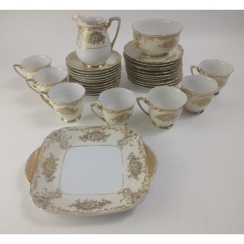 590B - A MEITO hand-painted tea service to include 7 cups, 13 saucers, 11 side plates, 1 sandwich plate 20c... 