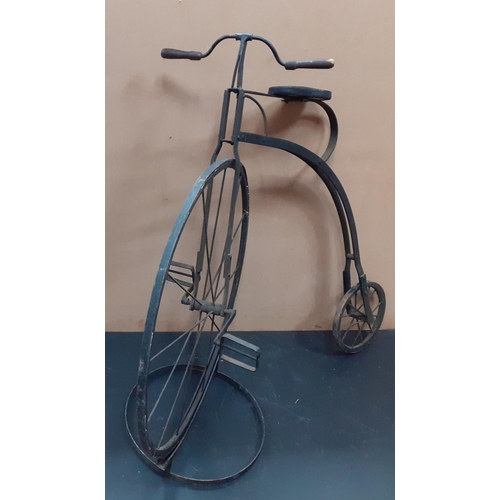 690 - A stylised decorative metal Penny Farthing bicycle on a metal stand.  Stands 107cm tall approx.#194... 