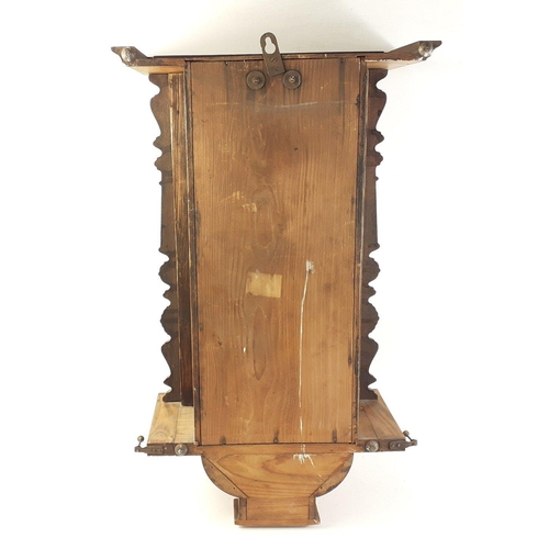 148 - A wall-mounted wooden pendulum clock with no maker's mark.  Length 66 x41cm approx#155