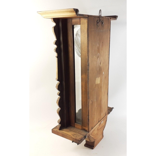 148 - A wall-mounted wooden pendulum clock with no maker's mark.  Length 66 x41cm approx#155