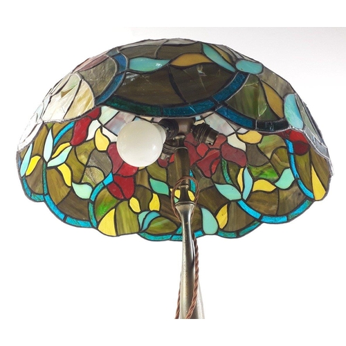 157 - A large Tiffany style lamp with shade 44cm approx, stands 63cm approx, some damage to shade.  Still ... 