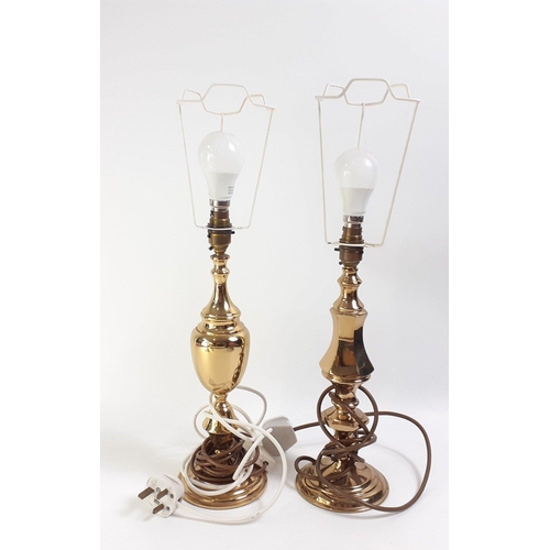 163 - A pair of small brass lamps with red shades, with also 4 other brass effect table lamps with shades ... 