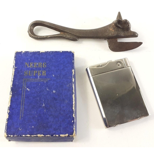 174 - An antique bull head Bully Beef steel tin opener in good condition. Also a boxed lighter with Connel... 