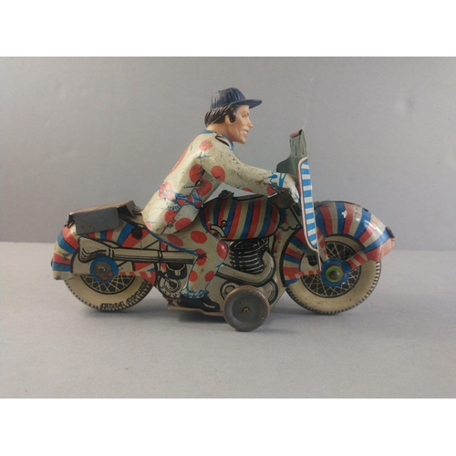 206 - A made in Great Britain clockwork motor cycle racer.  Works with a gentle wind.  Possibly METOY.  18... 