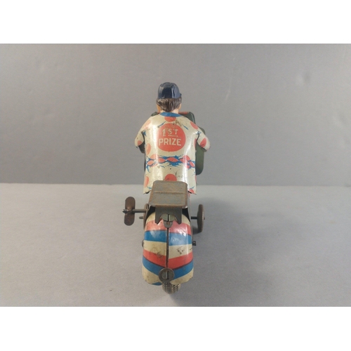 206 - A made in Great Britain clockwork motor cycle racer.  Works with a gentle wind.  Possibly METOY.  18... 