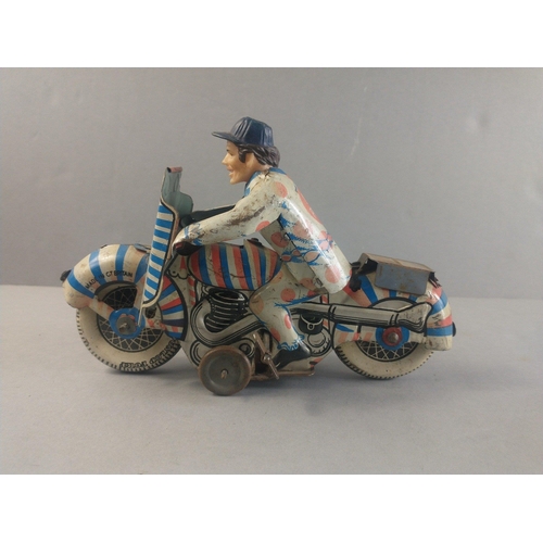 206 - A made in Great Britain clockwork motor cycle racer.  Works with a gentle wind.  Possibly METOY.  18... 