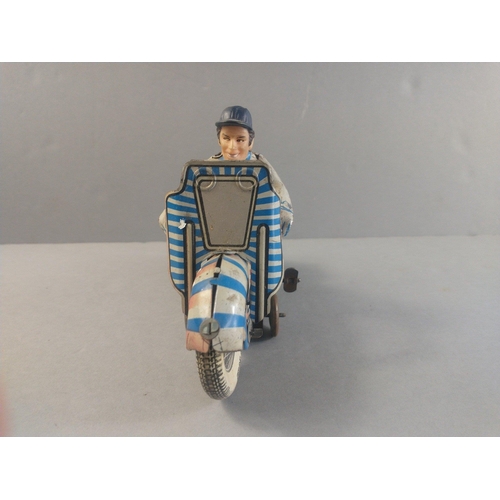 206 - A made in Great Britain clockwork motor cycle racer.  Works with a gentle wind.  Possibly METOY.  18... 