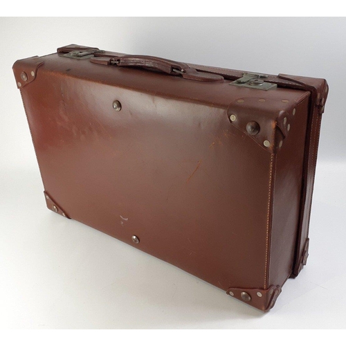 23 - A top quality leather suitcase with re-enforced corners.  Comes with lift out sections for vanity it... 