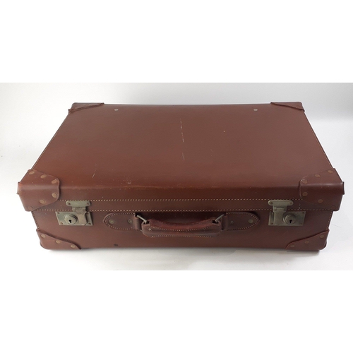 23 - A top quality leather suitcase with re-enforced corners.  Comes with lift out sections for vanity it... 