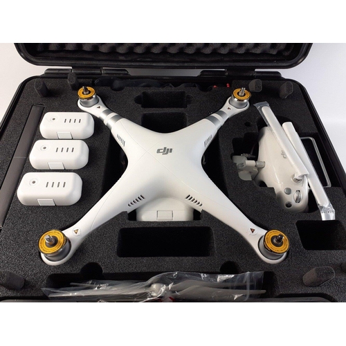 305 - A cased DJI PHANTON ADVANCED Model W322 in hard clam shell case with blades, batteries etc.  Appears... 