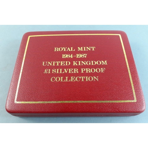 48 - A Royal Mint 1984-1987 United Kingdom £1 Silver Proof Collection coins in capsules, complete in... 